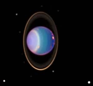 Montaje del planeta Urano con sus anillos casi verticales. Tomada de hubble.stsci.edu